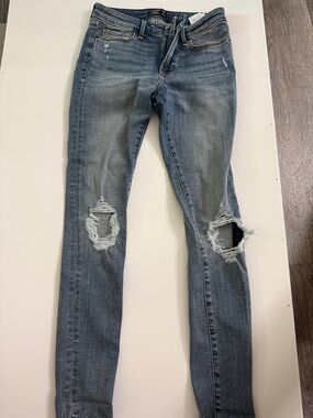 Women’s Distressed Mid-Rise Super Skinny Jeans